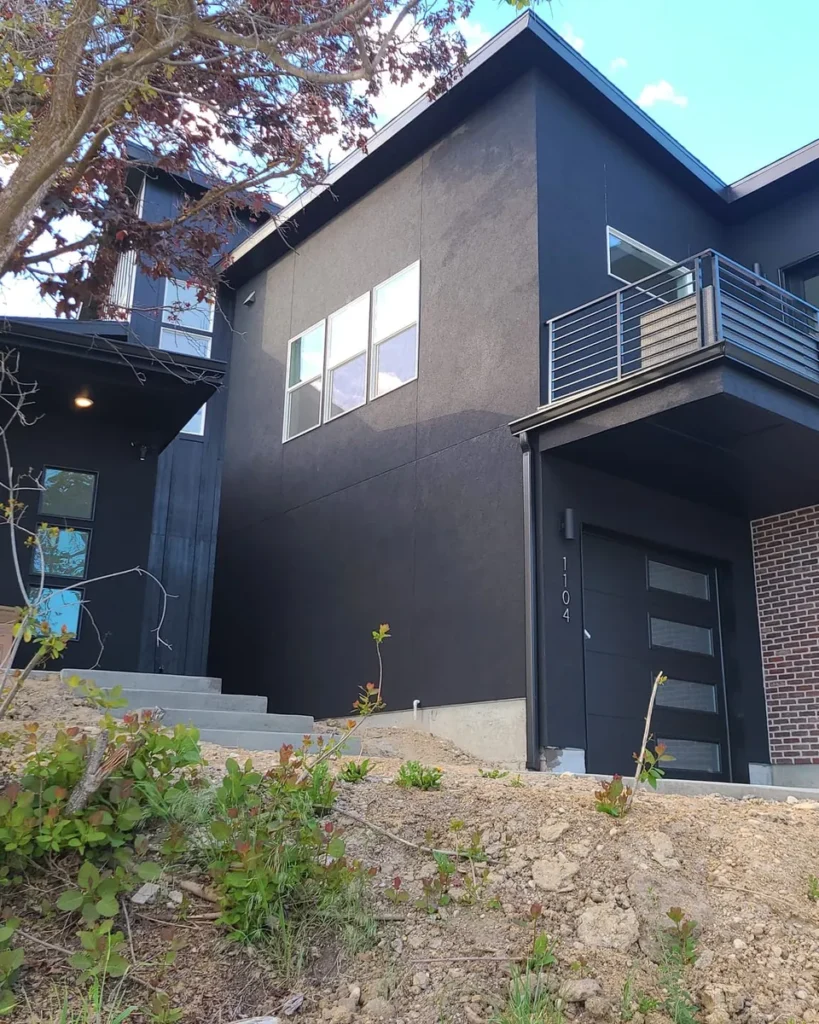 Freshly painted modern dark stucco home exterior in Boise, Idaho