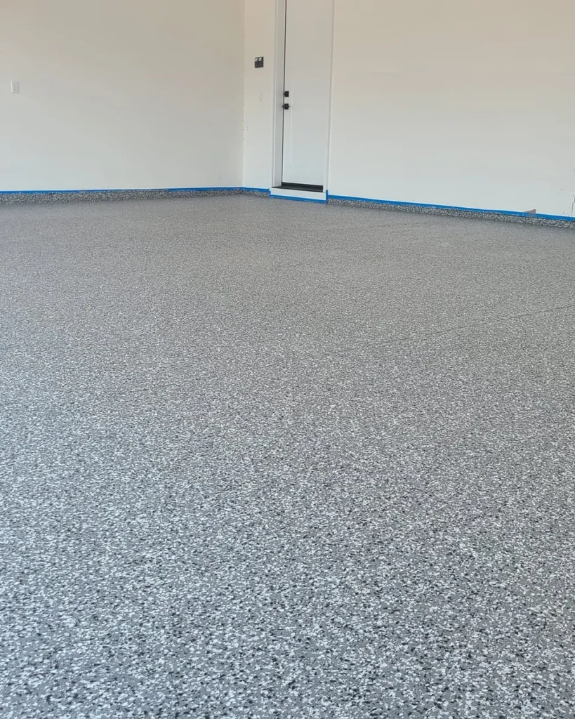 Finished light flake epoxy garage floor coating in a Treasure Valley home